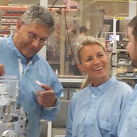 Interpreting during technical training in cleanroom of laser assembly