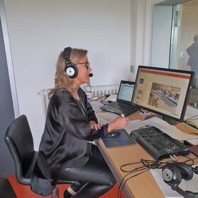 Team interpreting with Angelika Erdner in interpreter's booth at company HOMAG