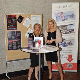 Information desk of Margit Schuck, Technical Language Service for Intercultural Communication, and Henriett Stegink of Steginkgroup at Symposium EPO-KAD